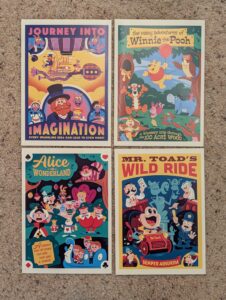 four postcards: Journey Into Imagination, Winnie the Pooh, Alice in Wonderland, Mr. Toad's Wild Ride
